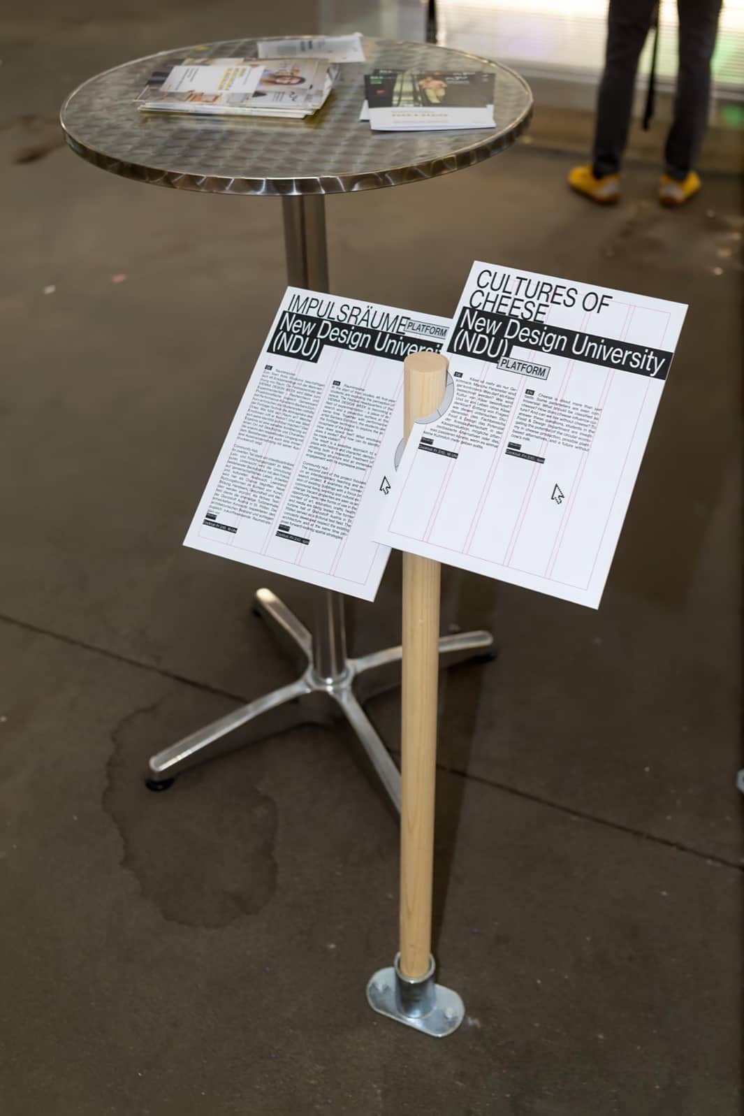 Photograph of one of the sign posts with two information cards.