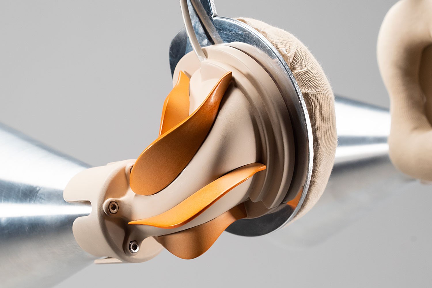 detailed photo of a headphone-looking piece with metall funnels