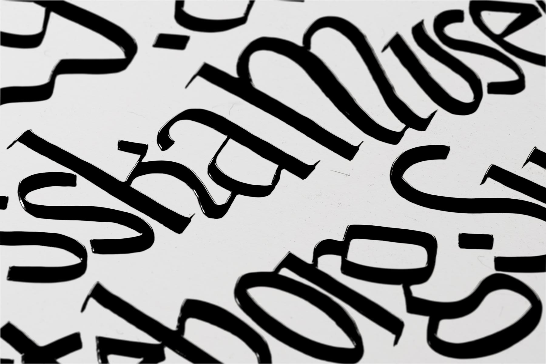 Custom display typeface showing letterforms with gothic yet wave-like characteristics