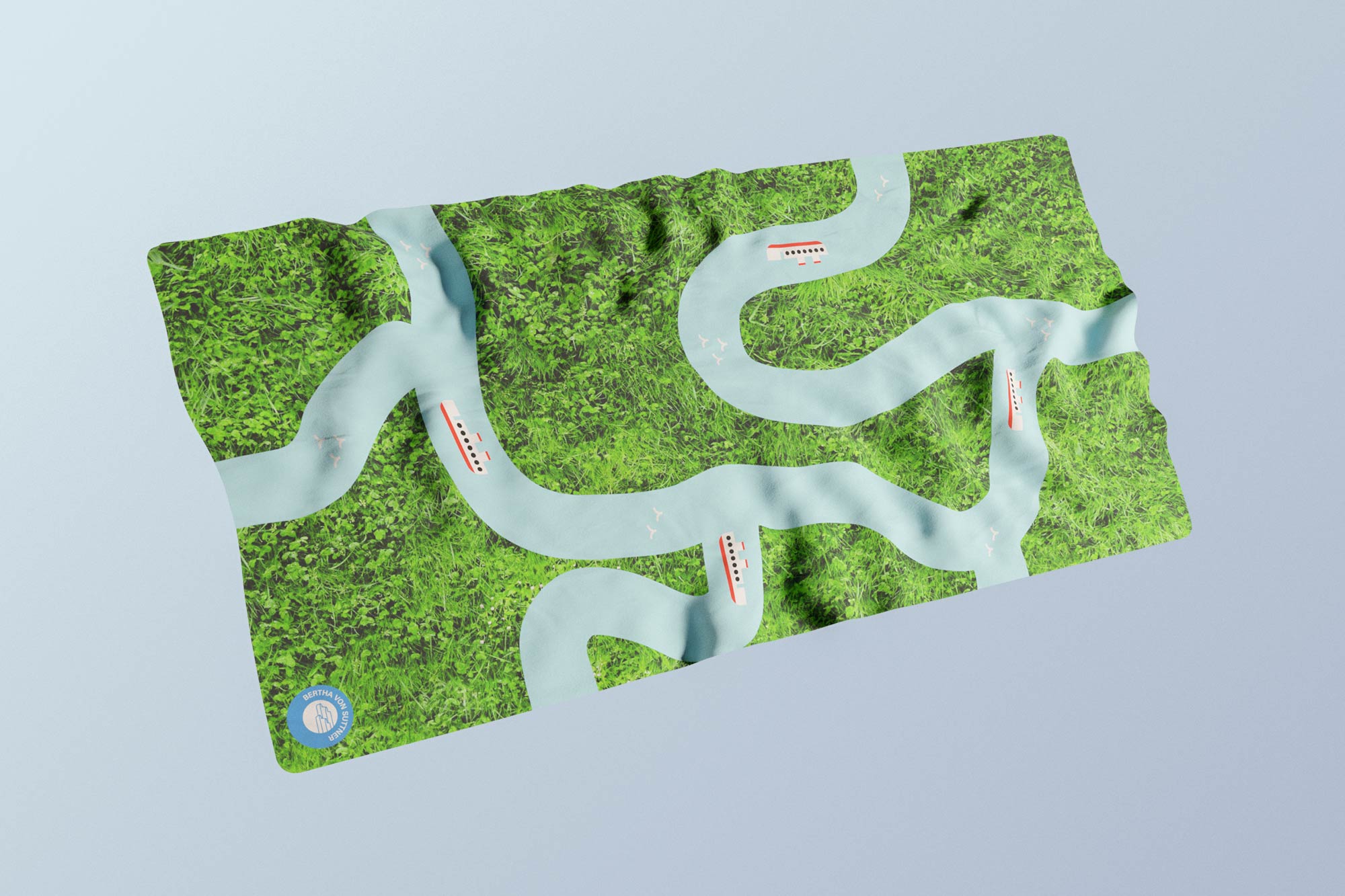 Rendering of a printed towel with a grass background featuring a river landscape