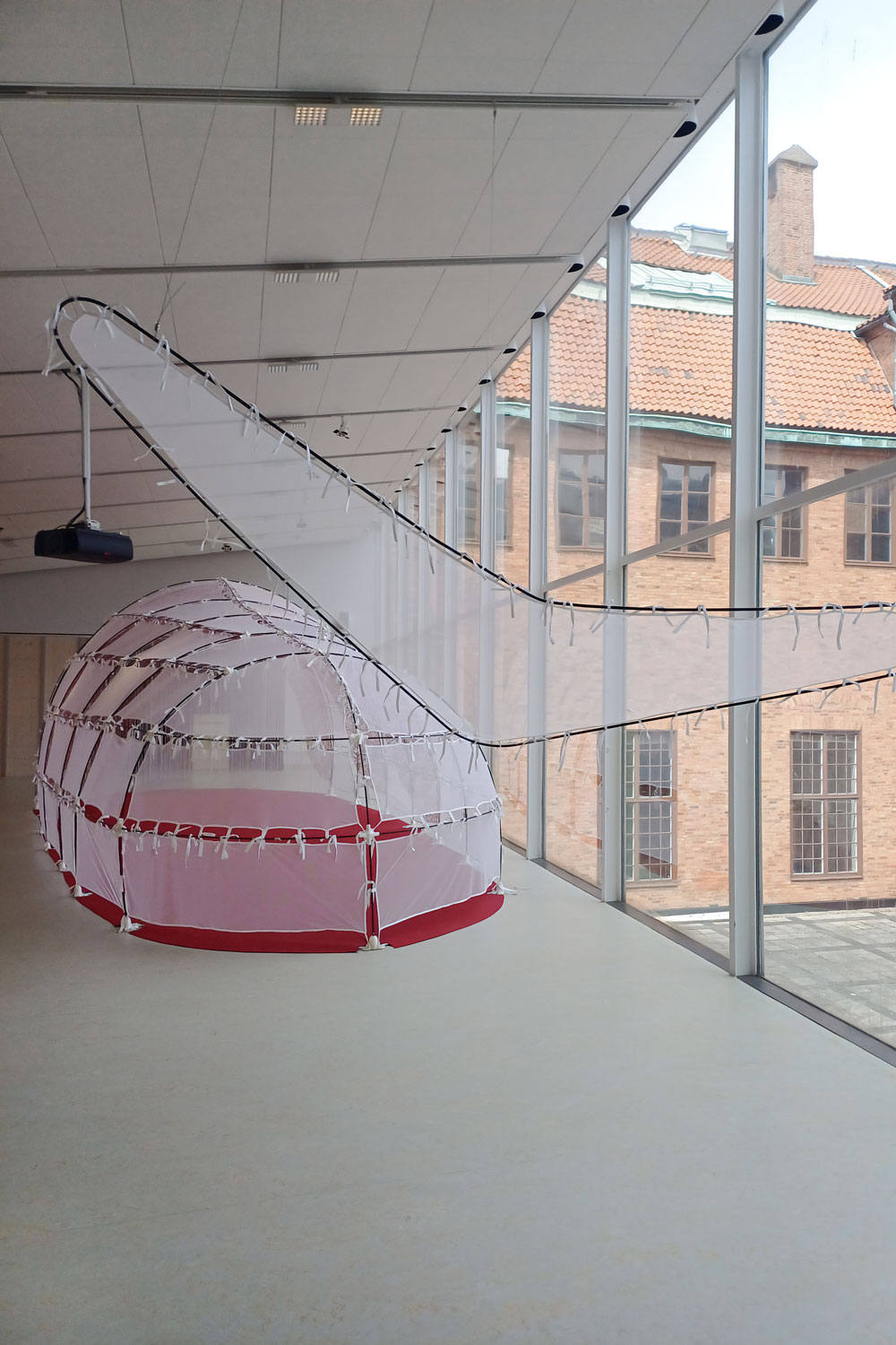 Exhibition display featuring collapsible tent structure